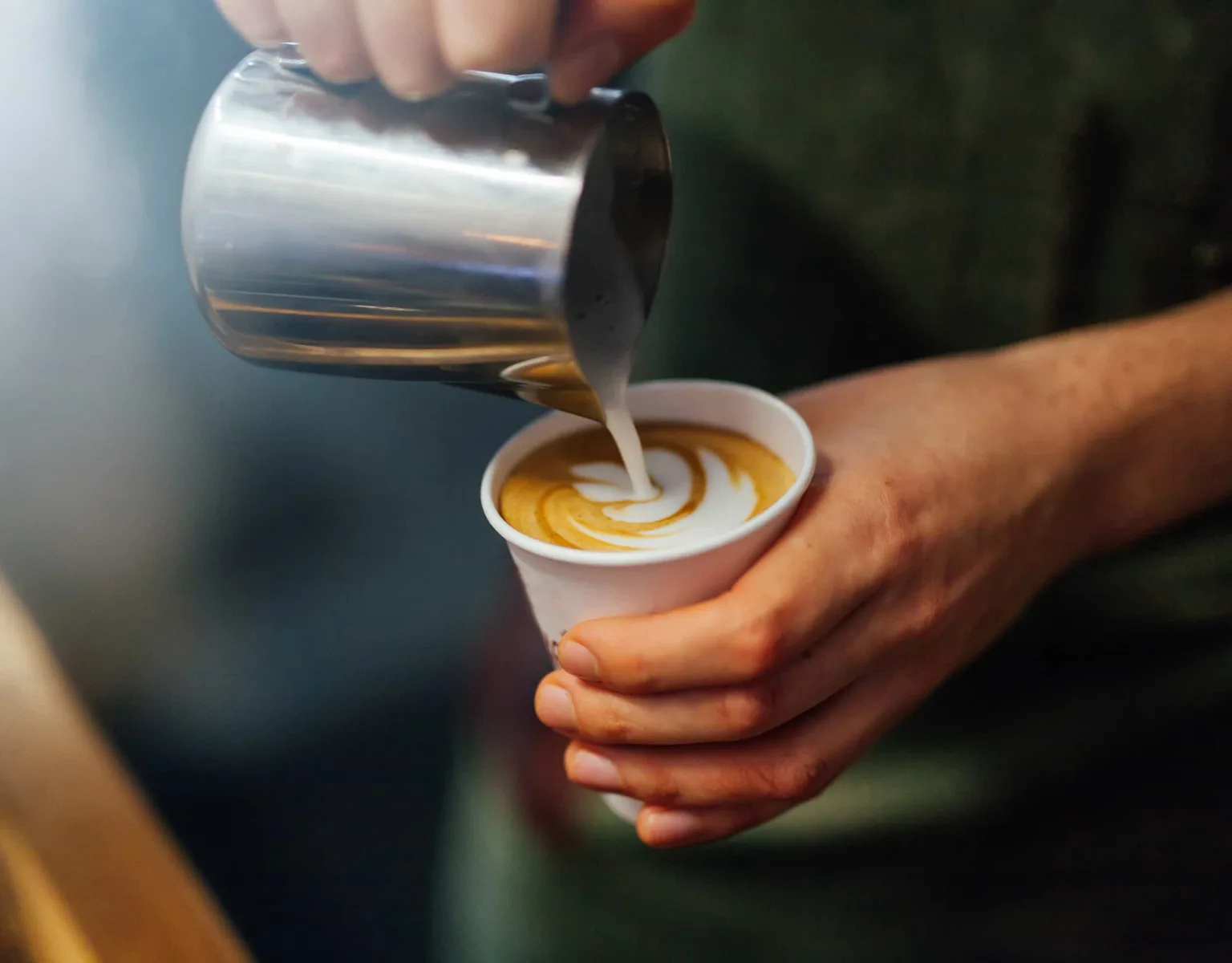 Closeup of a barista making a beverage
