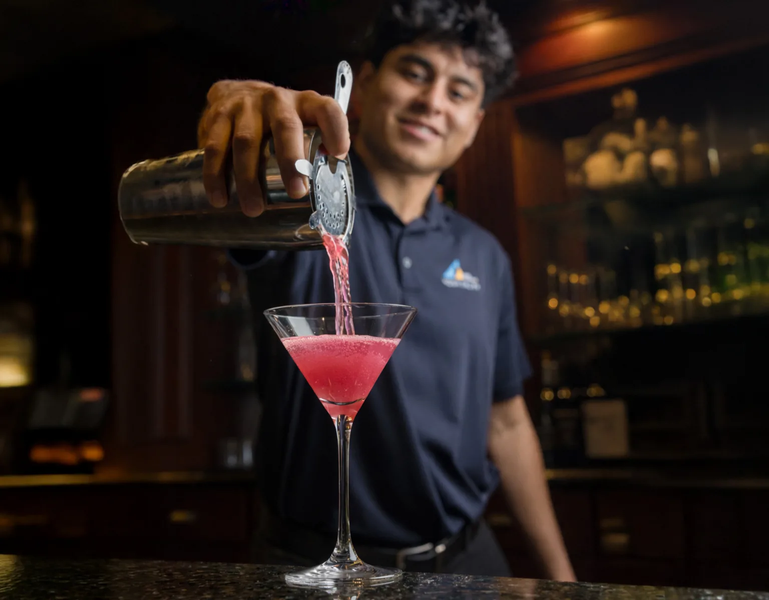 A bartender making a cocktail