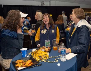 A group of friends wearing Naval Academy apparel