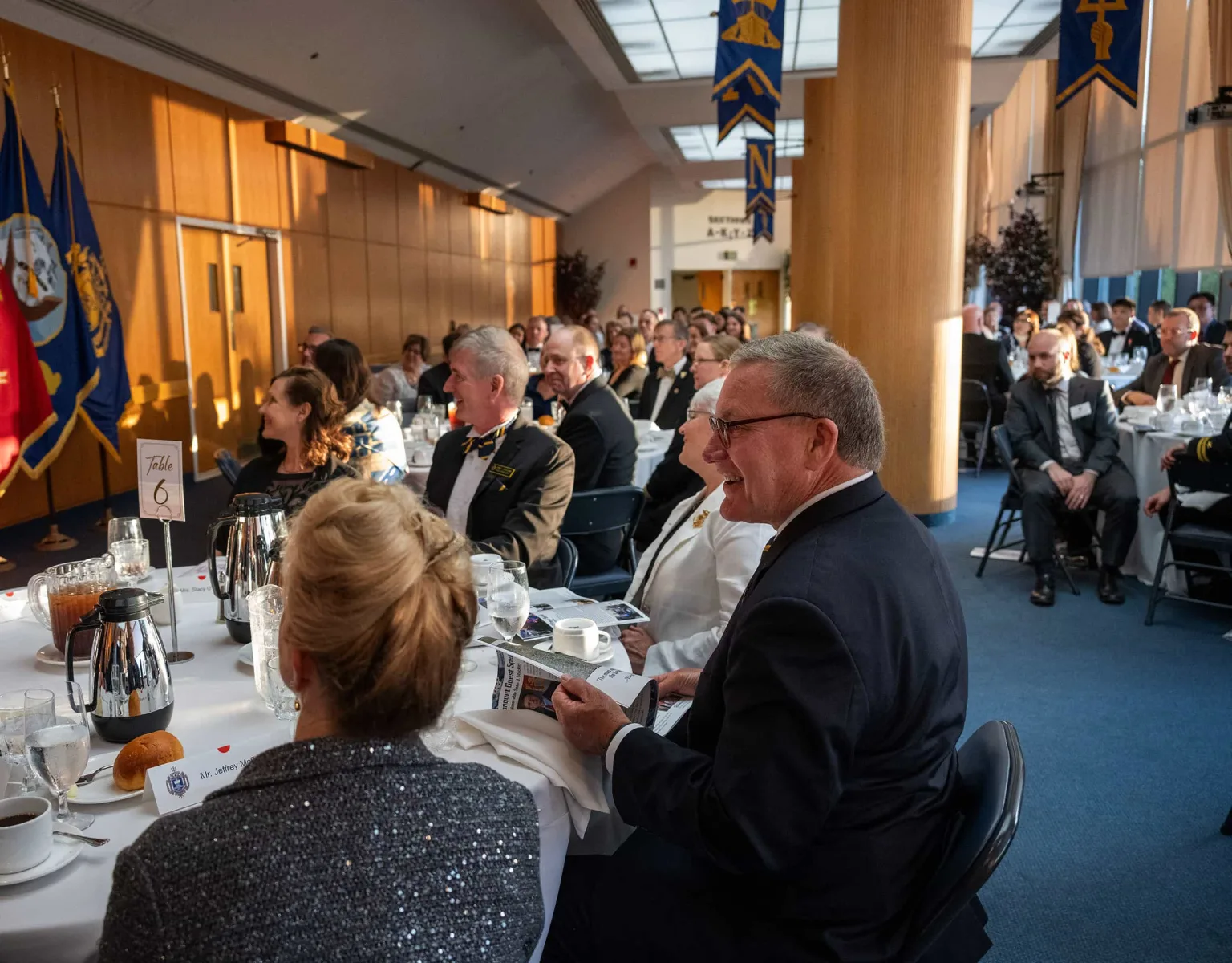 Guests seated at tables inside the Bo Coppedge Room