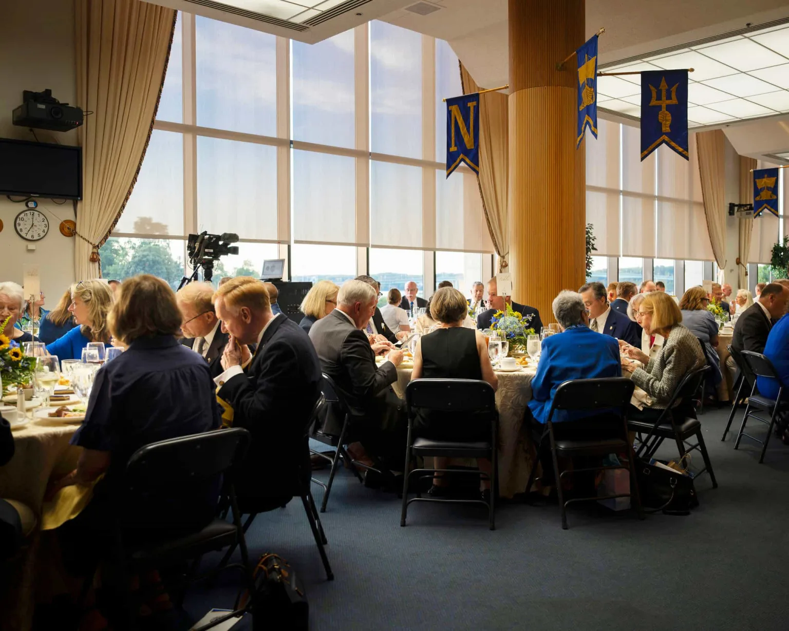 Guests enjoying dinner inside the Bo Coppedge Room