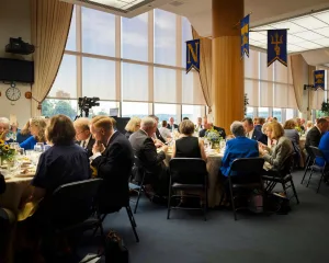 Guests enjoying dinner inside the Bo Coppedge Room
