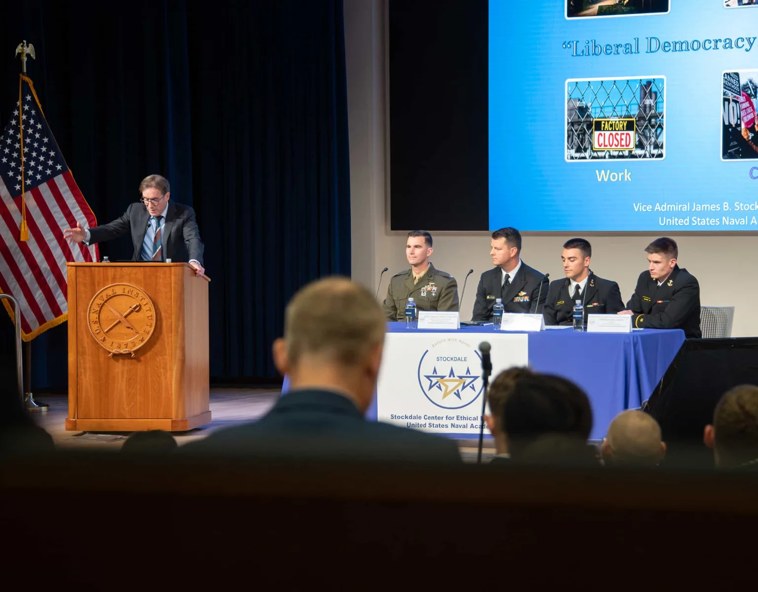 A panel of speakers at a conference