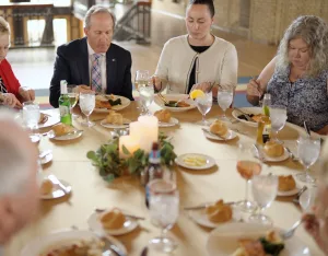 Guests sitting at a table eating dinner