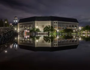 Exterior of Alumni Hall at night