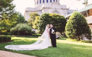 A bride and groom outside of the USNA chapel