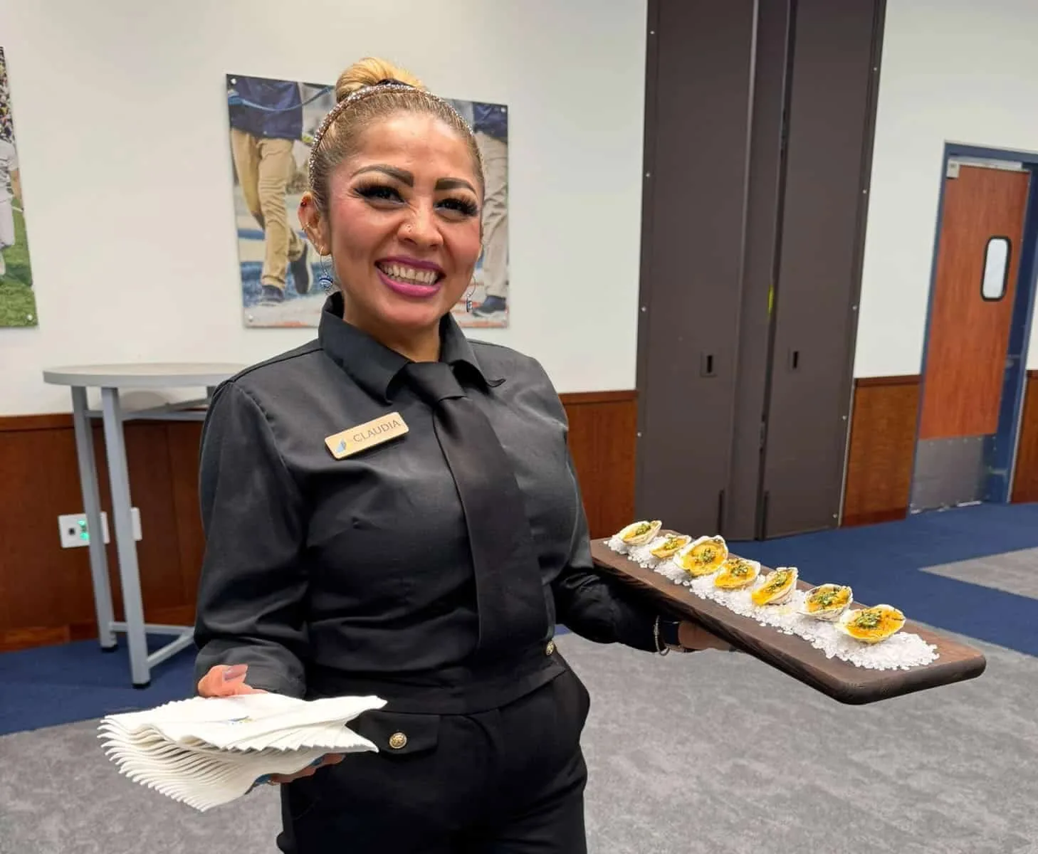 A server holding a tray of hors d'oeuvres
